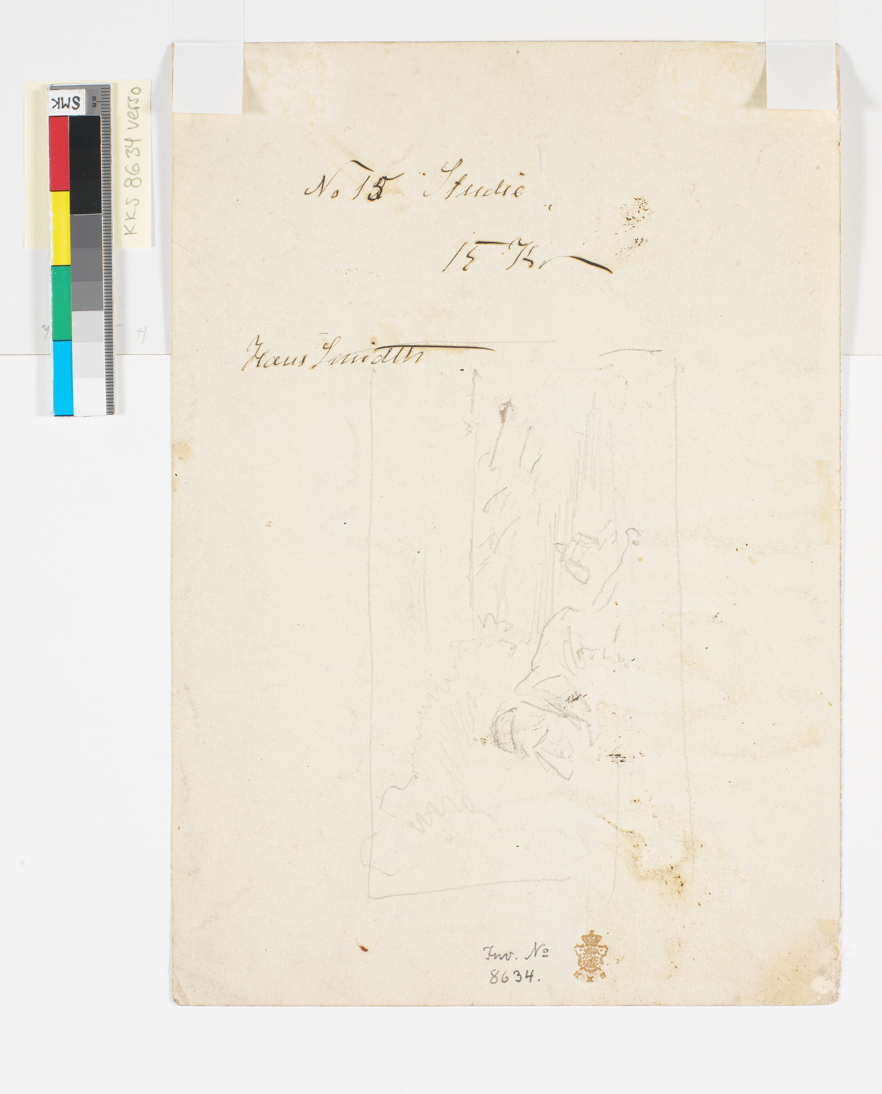 Liggende figur ved strand